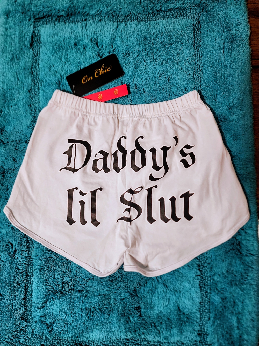chic White Athletic Booty Shorts with Black Gothic Scriptdance wear.